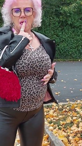 Naughty Granny Tongue Out Flashing Big Tits in Public