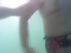 Chick touches her man under water and makes him cum