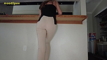 Lola Leda pissing her tight pants at work behind counter