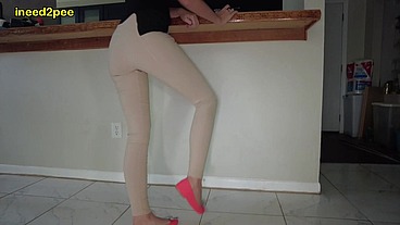 Lola Leda pissing her tight pants at work behind counter