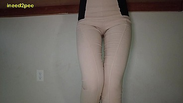 Lola Leda pissing her tight pants at work behind counter