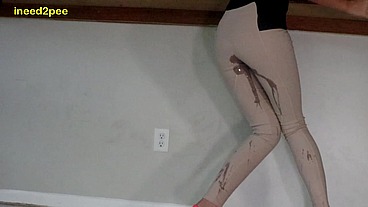 Lola Leda pissing her tight pants at work behind counter