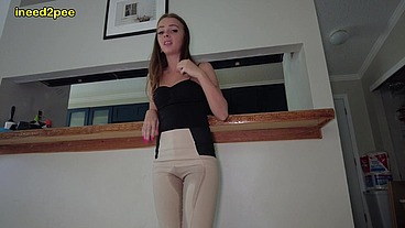 Lola Leda pissing her tight pants at work behind counter