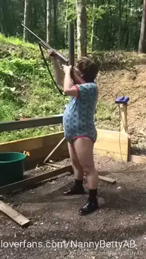 At the rifle range in a onesie