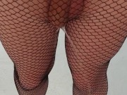 Femboy in fishnet stockings pees and play with his piss