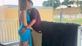 Strangers making out on a balcony during the party.