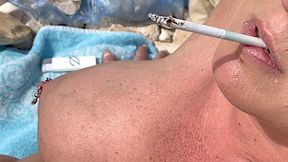 Smoking Cigarettes on the Beach at day and in Sunset (wmv)