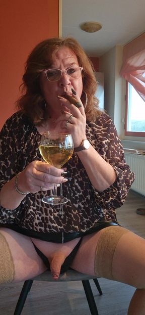 Smoking a cigar and enjoying a warm drink