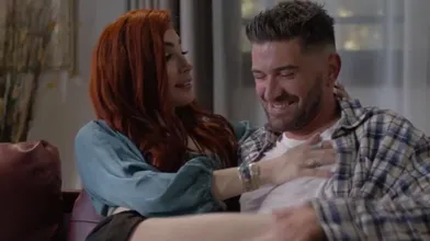 A Redhead Shemale Bares Her Tight Ass To Her Guy Mistress