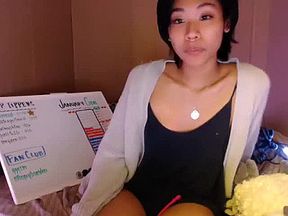 Asian teen plays with toys on webcam 02