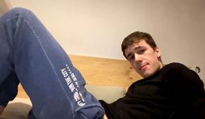 young man stroking his uncut dick on cam