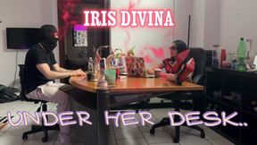 UNDER HER DESK..