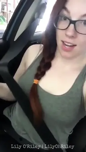 Braless, pale redhead solo fingering for a satisfying car-masturbation orgasm