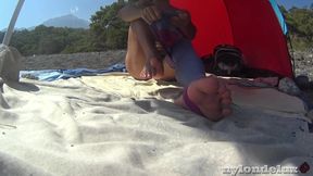 Ultra shinny leggins pantyhose on the beach