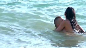 Brunette slut gets fucked doggystyle on the beach