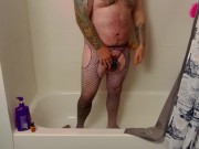 Caged fag bou plays with toys in the shower