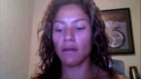 Sporty webcam model with curly hair shows off her big fake boobs