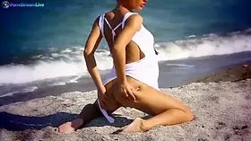 Honey Demon thinks erotic thoughts as she ambles on the beach