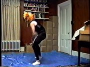 wearing black tights & crop top, stocking mask & wig hump air pillow 1990's