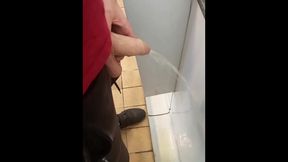 Hung lad at urinal next to me gets semi while pissing!