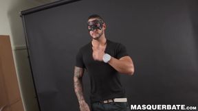 Muscular masked hunk jerks off his big erect cock solo
