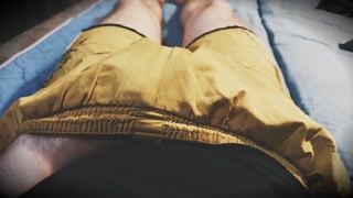 The guy in yellow shorts is entertaining himself
