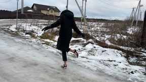 A girl in high-heeled shoes was walking on ice, slipped, fell and hit her foot so hard that she can no longer walk normally