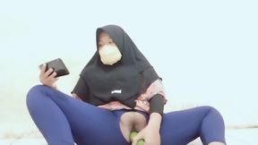 Indonesian hijab aunt wearing cucumber