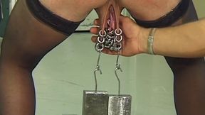 Mature Redhead MILF Endures Needles and Heavy Weights