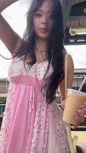 Asian babe shows off her big tits