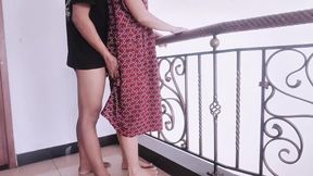 Red daster girl by sister-in-law on rooftop while hanging out