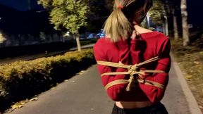 bound girl walk outside late at night