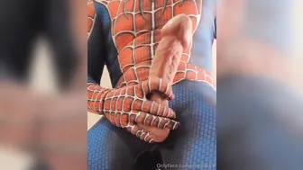 Spider-Man cosplay twink jerks his big cock and shoots a huge load