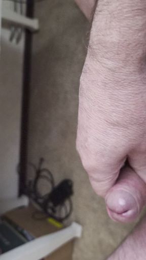 My Friend Sits in a Chair and Jerks His Cock While Watching the Video Until He Orgasms