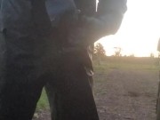 Lad hauls cock and balls out from PVC coveralls to take a piss
