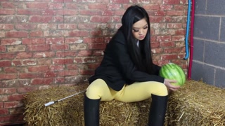 Equestrian Louisa crushing fruit wearing boots