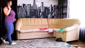 Busty brunette BBW helps herself in the undressing room