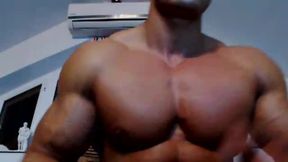 Muscle Hunk Flexes Muscles for Camera