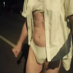 Bella does a night time lingerie walk down the street