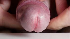 Spreading cock urethra with cum close up