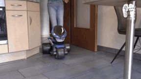 Electrical Motobike under two booted Girls