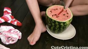 ”Charming Christina squashing watermelon”