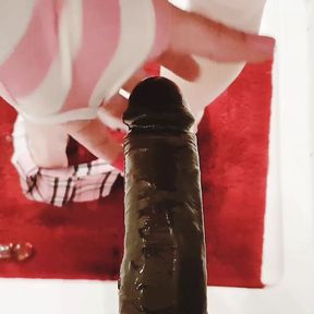 Sissy Tina Noxx fucks a big black dildo in the shower