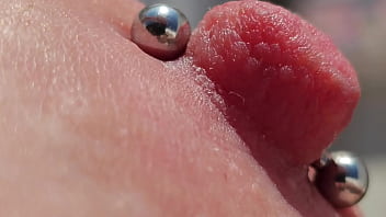 Playing Pierced Nipples Close Up on Balcony
