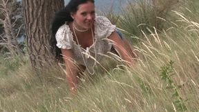 Sexy MILF with big tits gets naked outdoors