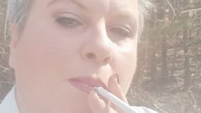 Mature Lady L outdoors smoking clip #1