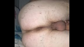 A gay man with a huge ass takes off his black thong and starts masturbating in front of the camera! His whole crotch is covered with tattoos!