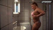 Curvy Tattooed Blonde Struts in Platform Heels and a Tiny Bikini