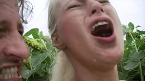 An attractive blonde babe gets her asshole destroyed outdoors
