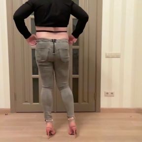 Femboy in grey skinny back zipper jeans, high heels and black cropped blouse dancing masturbating and cum